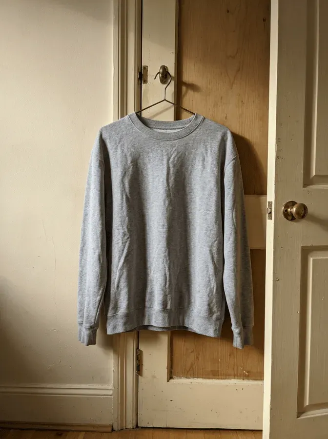 A jacket photographed on a hanger, as a marketplace listing shows it.